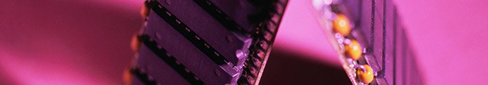 close up of printed circuit board with pink lighting